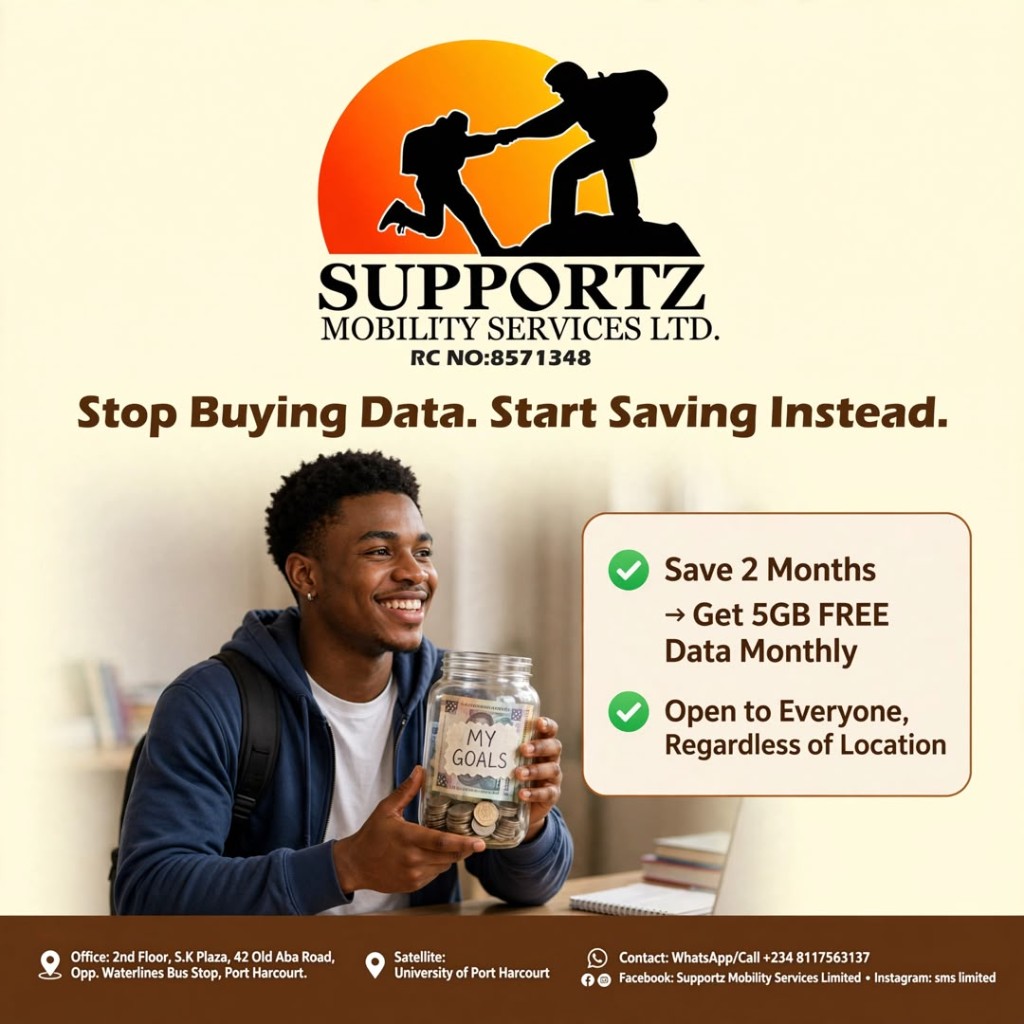 A young man smiling while holding a glass savings jar labelled My Goals, filled with coins and notes
